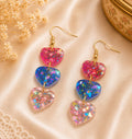 Boucles d'oreilles pendantes fantaisie trois coeurs multicolores